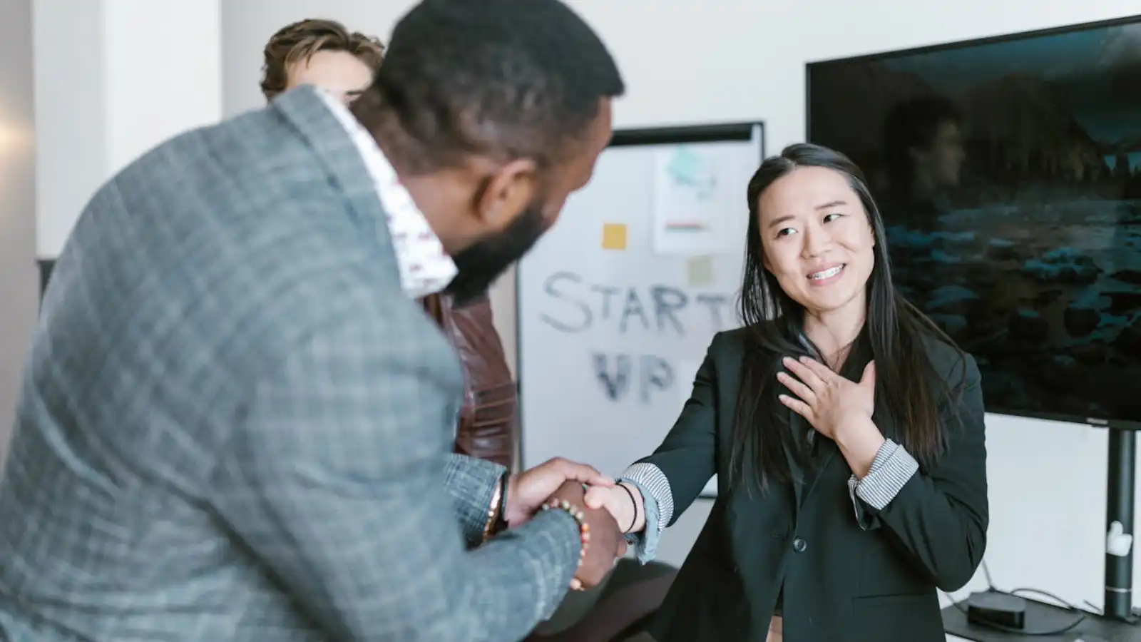 A man shaking hands with a Lady